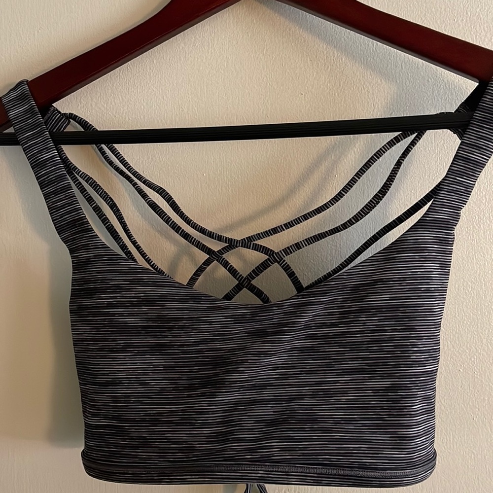 Lululemon strappy sports bra. Size 10. Black with shadow stripes.